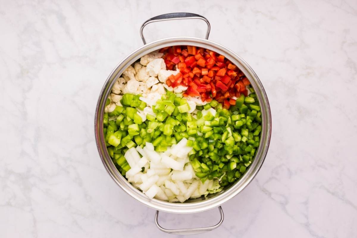 mixed chopped veggies in stainless steel pot.