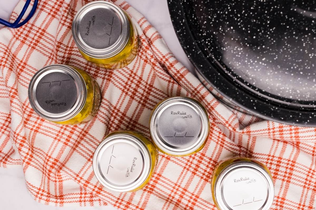 overhead view of finished jars cooling on towel.