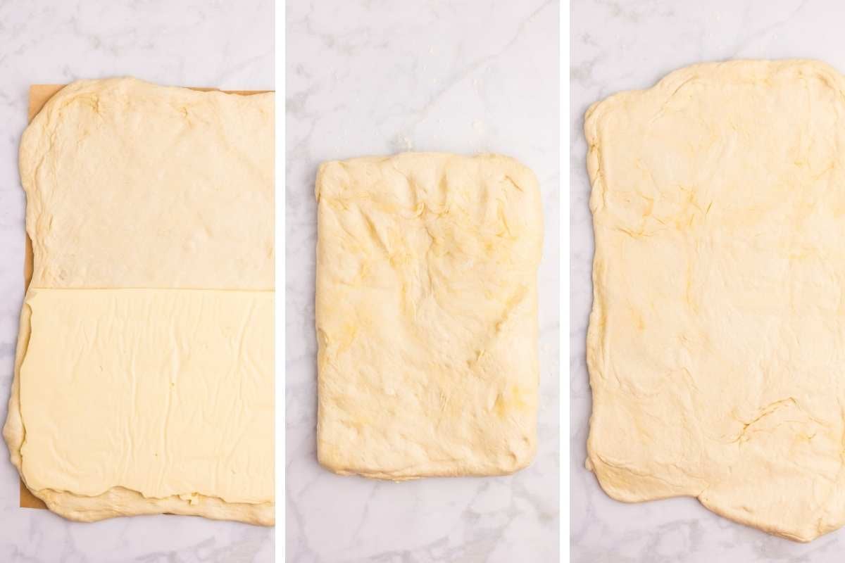 Butter layer placed on rolled-out dough, folded over butter to enclose it.