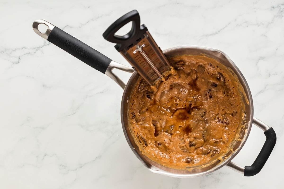 vanilla added to thick praline mixture in saucepan