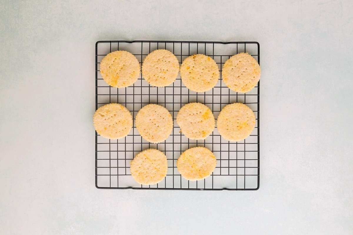 Baked lemon shortbread cookies cooling on a wire rack.
