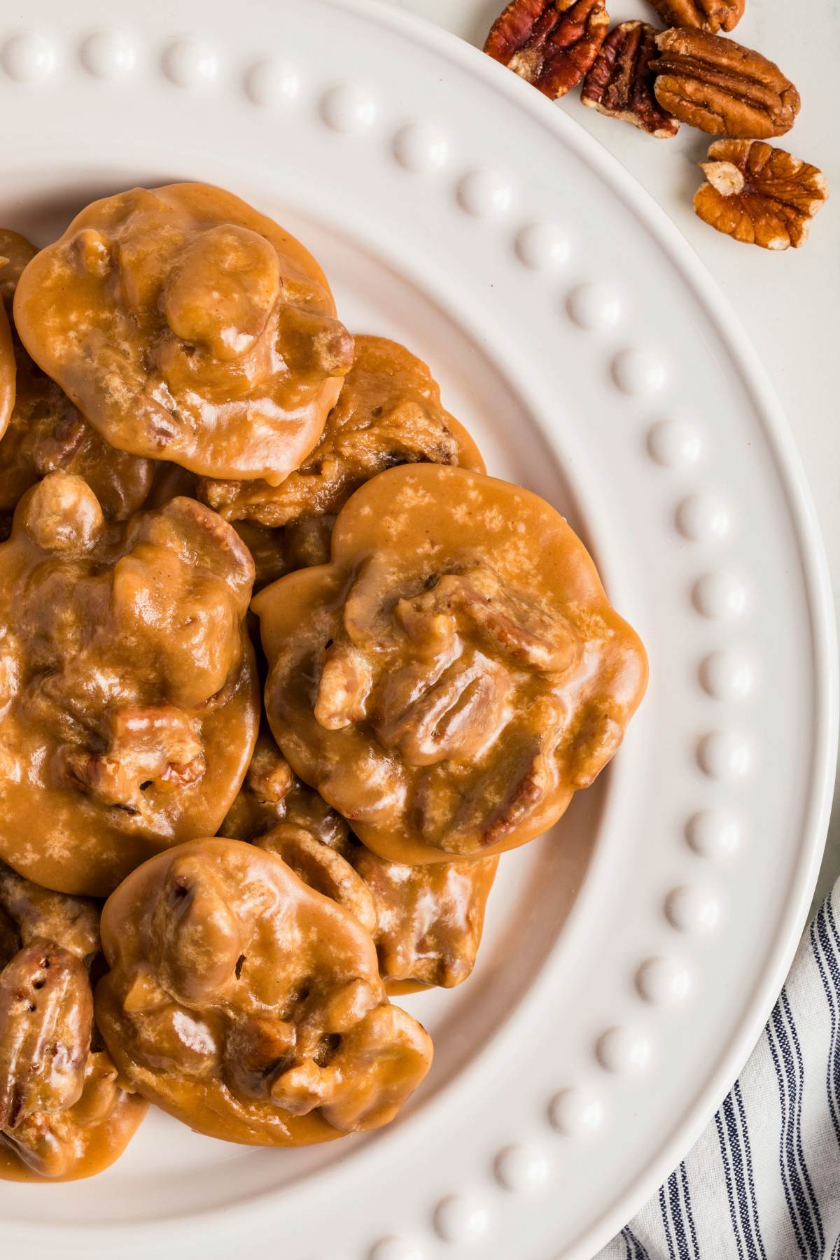 Pecan pralines arranged on a white plate