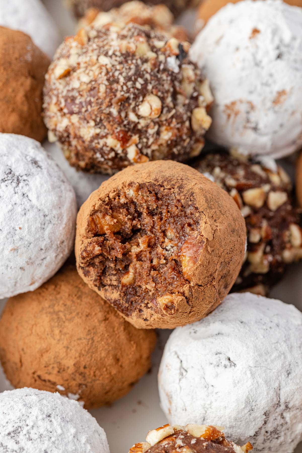 Close-up of bourbon balls showing different coatings.
