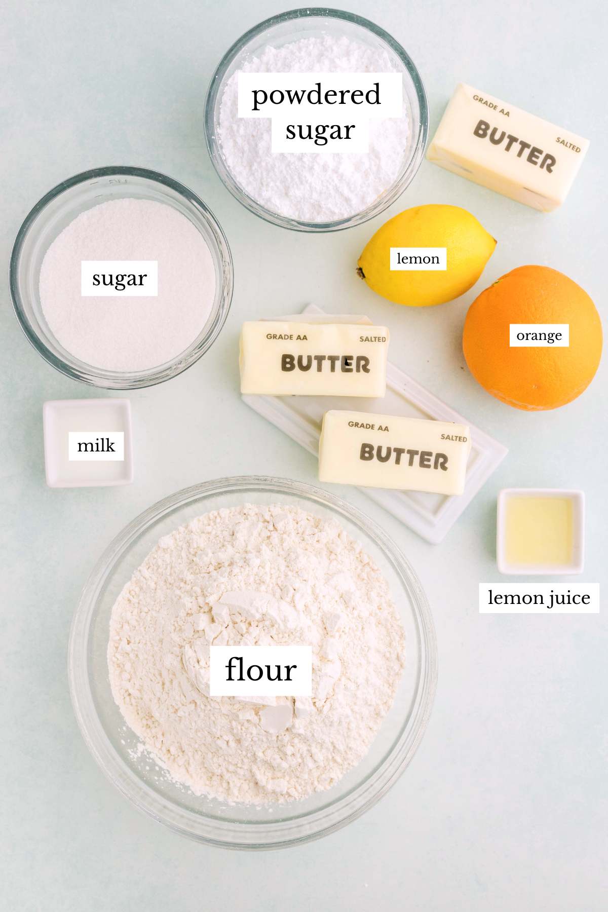 Baking ingredients for lemon shortbread cookies arranged on a counter.