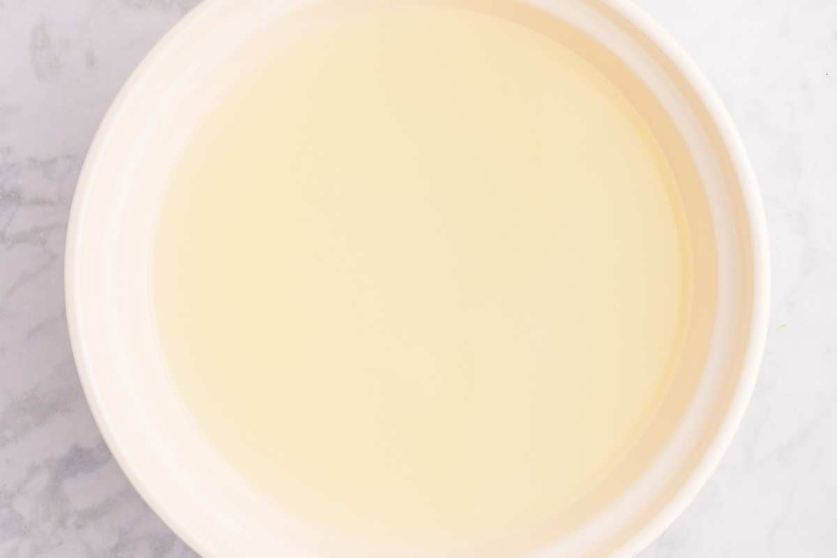 Bowl filled with lemon water for soaking sliced apples.