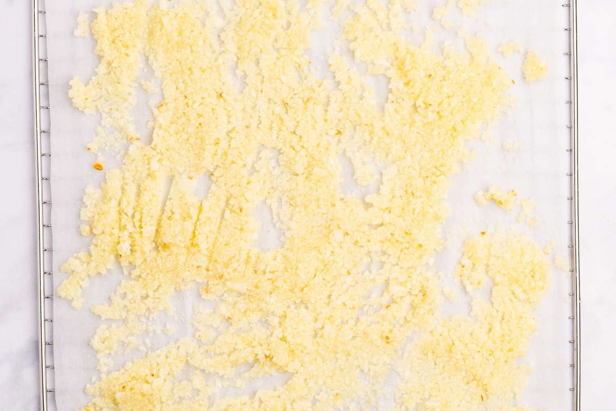 Freshly chopped garlic spread on dehydrator tray.