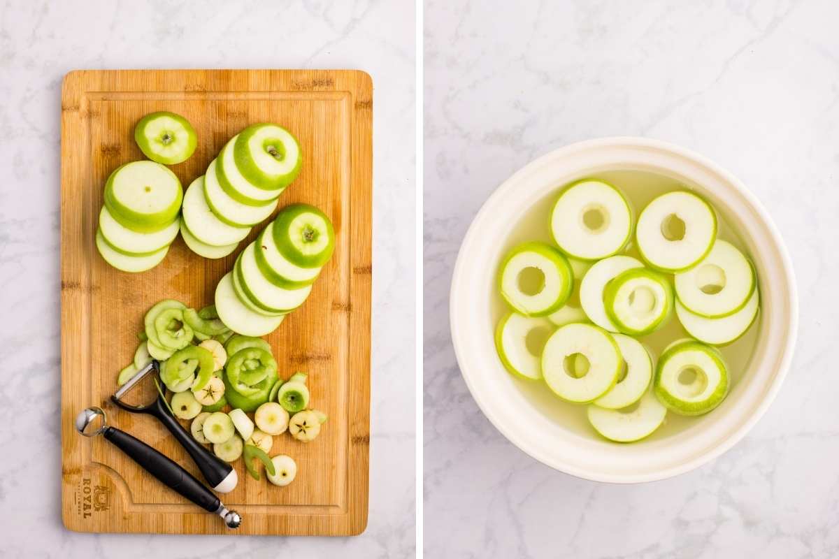 Cored apple rings on cutting board and in lemon water bowl.