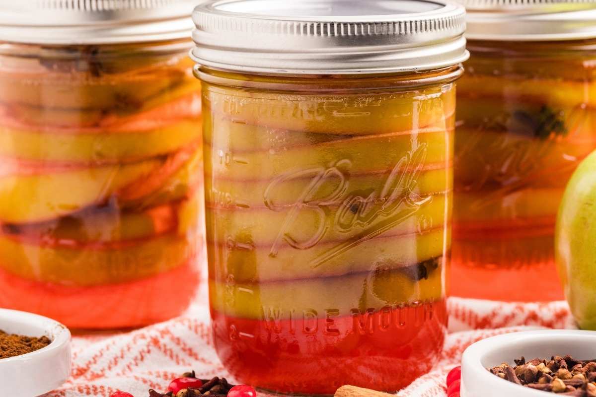 3 jars on red and white towel.