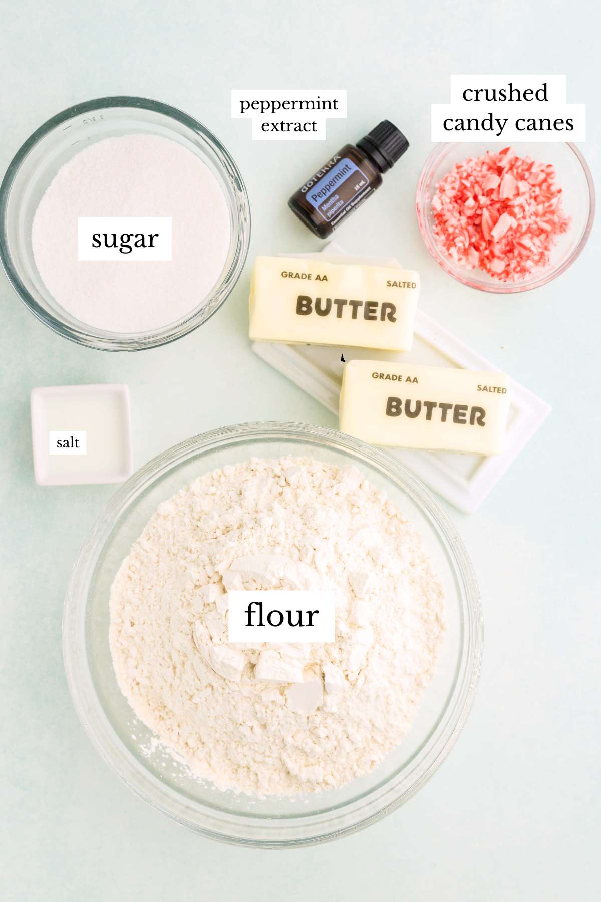Bowls of flour, sugar, butter, candy canes, and peppermint extract.
step 1 peppermint shortbread.jpg – Butter an