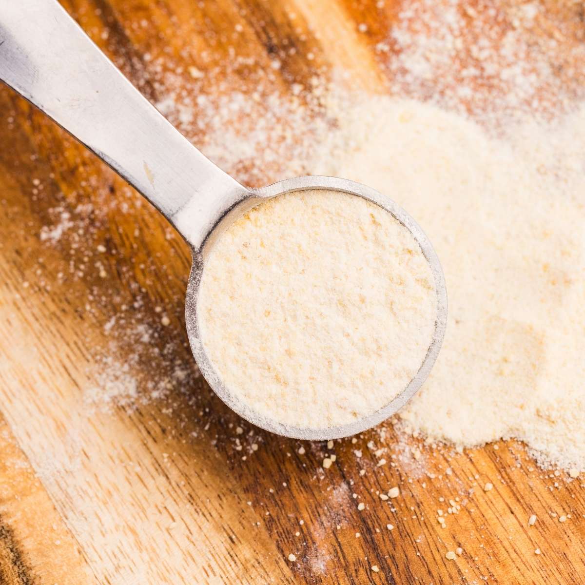 close up of measuring spoon of garlic
