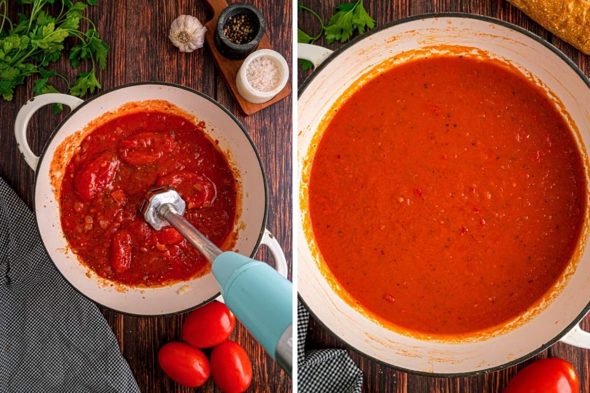 An immersion blender puréeing the sauce until it is smooth and red.