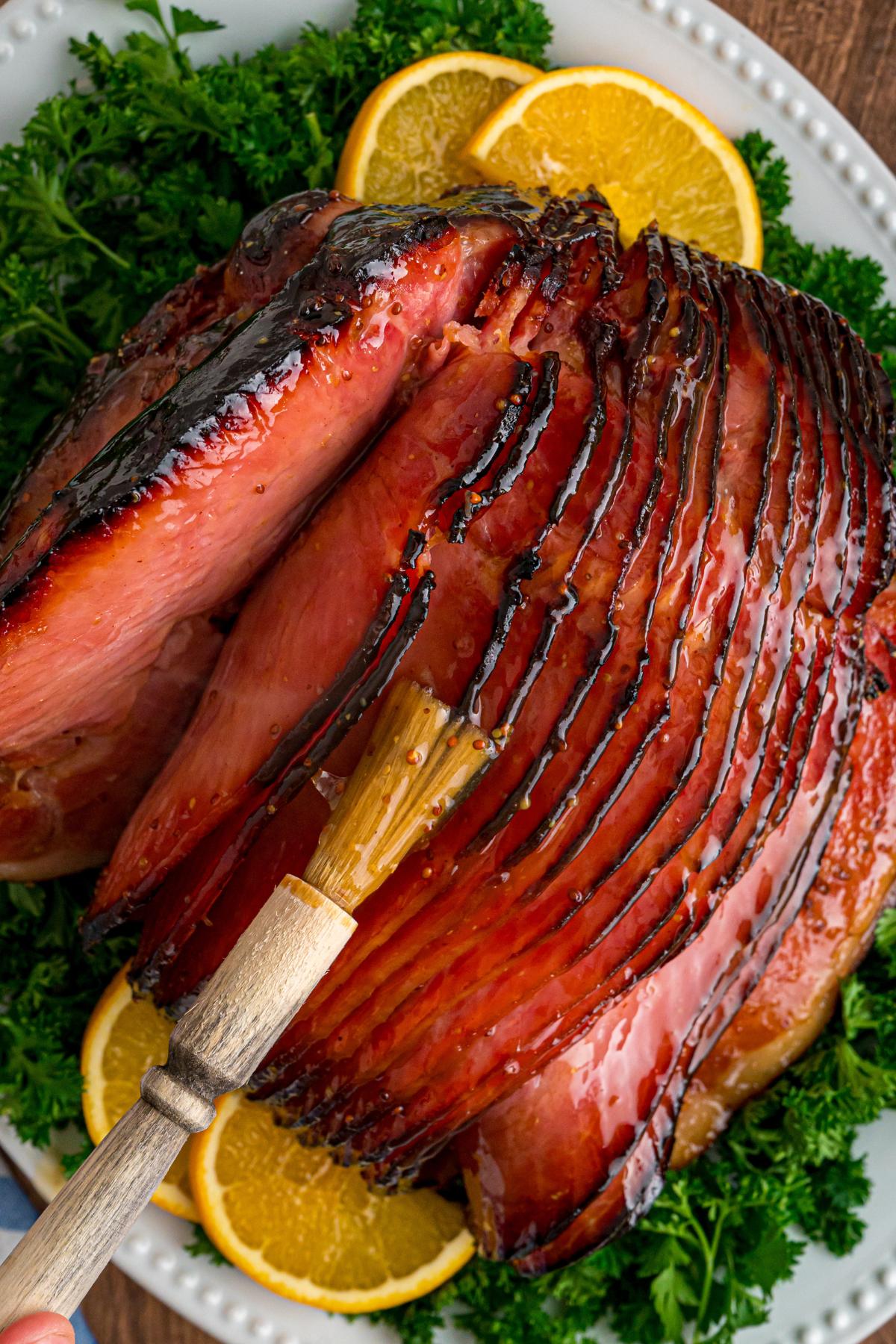 overhead view of caramelized sliced ham on platter.
