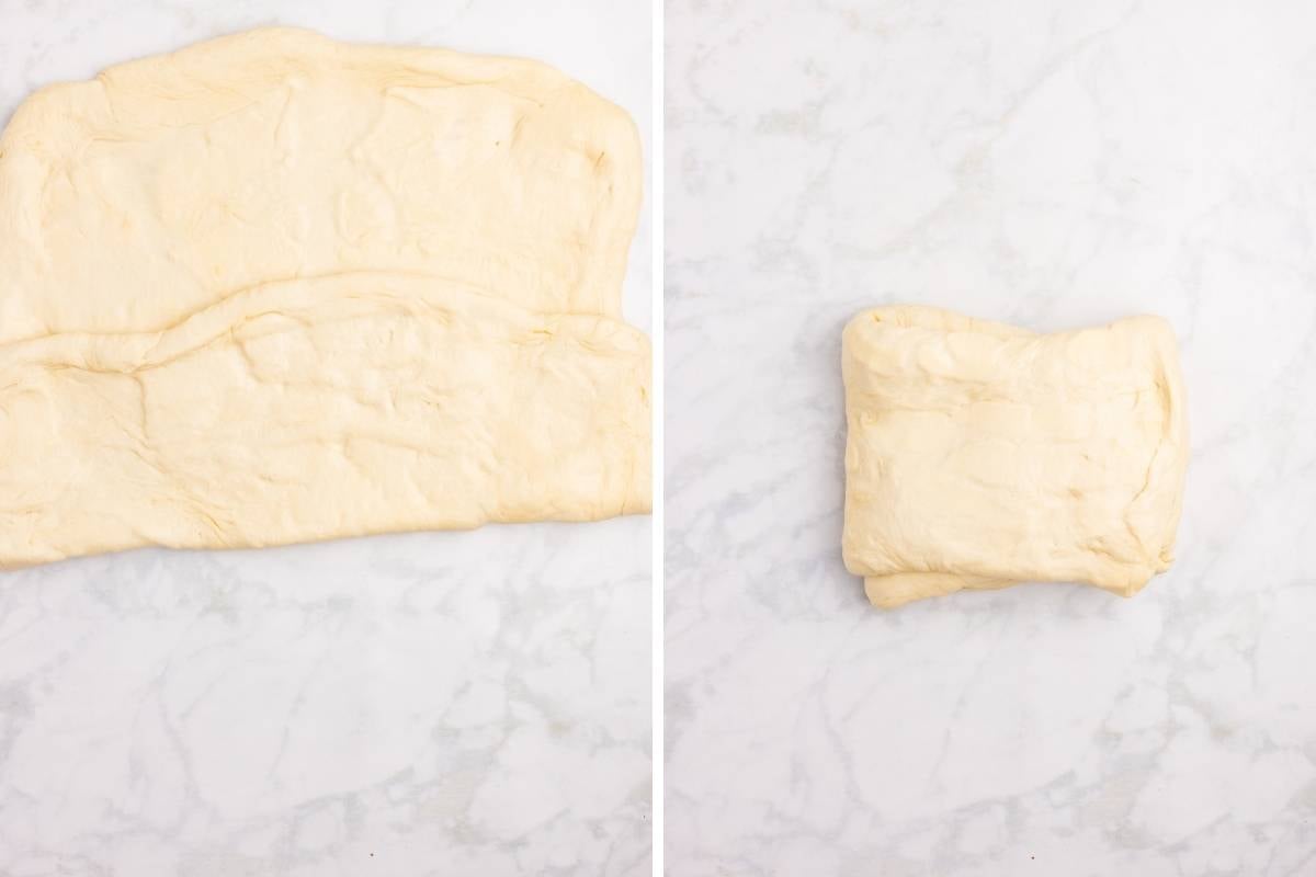Rolled out dough in the process of being folded up.