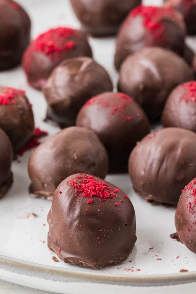 lots of truffles on white background.