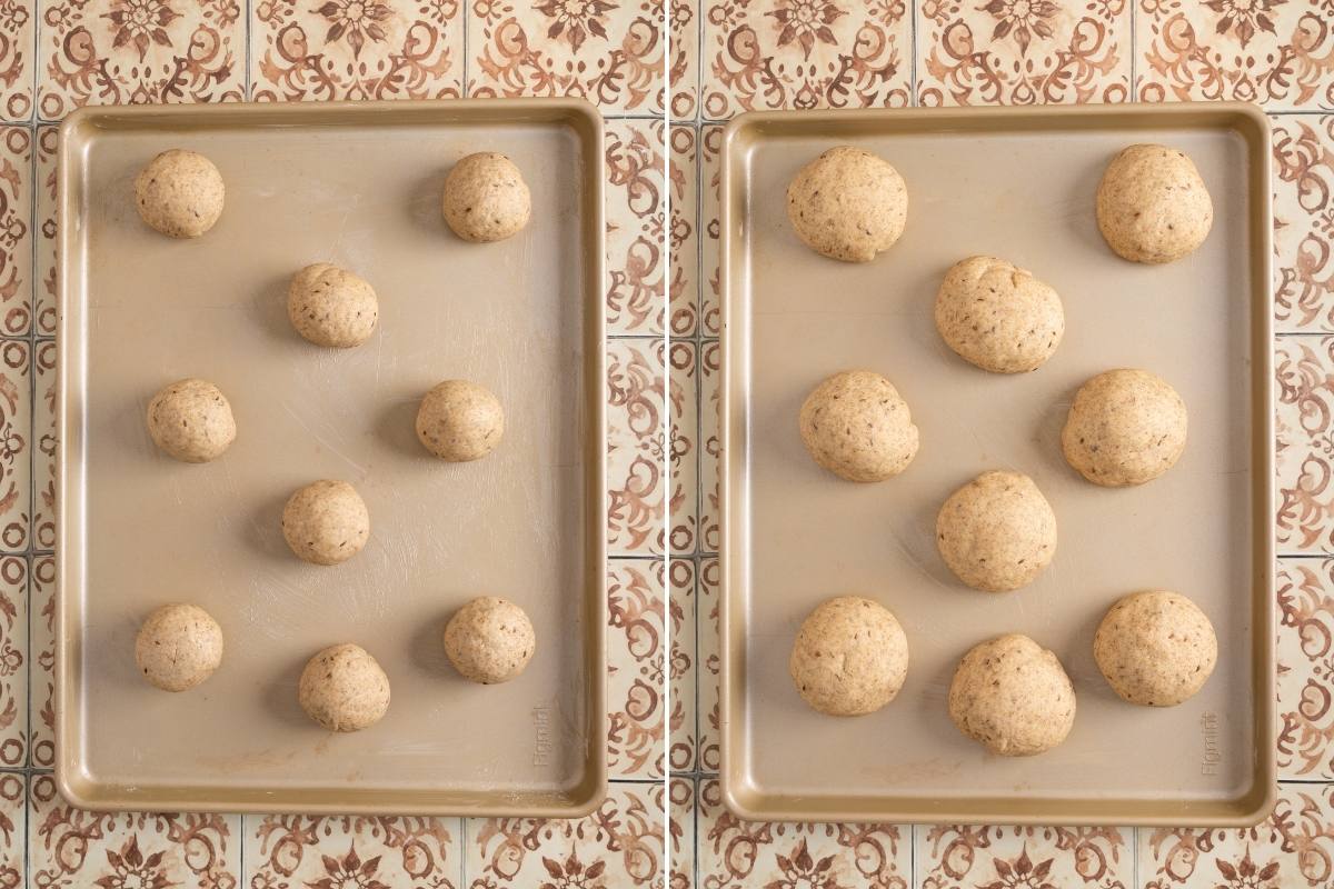 Two greased baking pans each with nine shaped round dough rolls, ready for second rise.