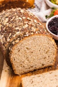 loaf of bread sliced on board.