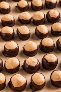 rows of buckeye balls laid out on parchment.