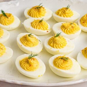 plated deviled eggs with piped filling.