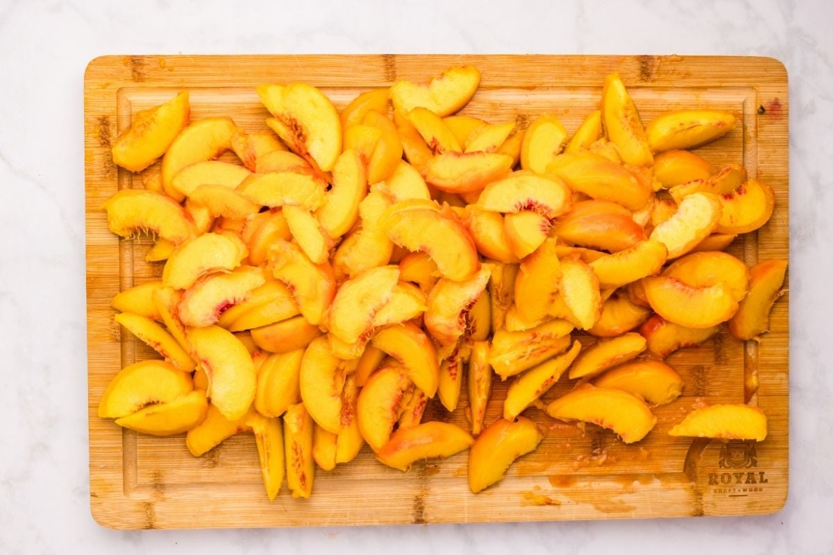 Sliced peaches on cutting board