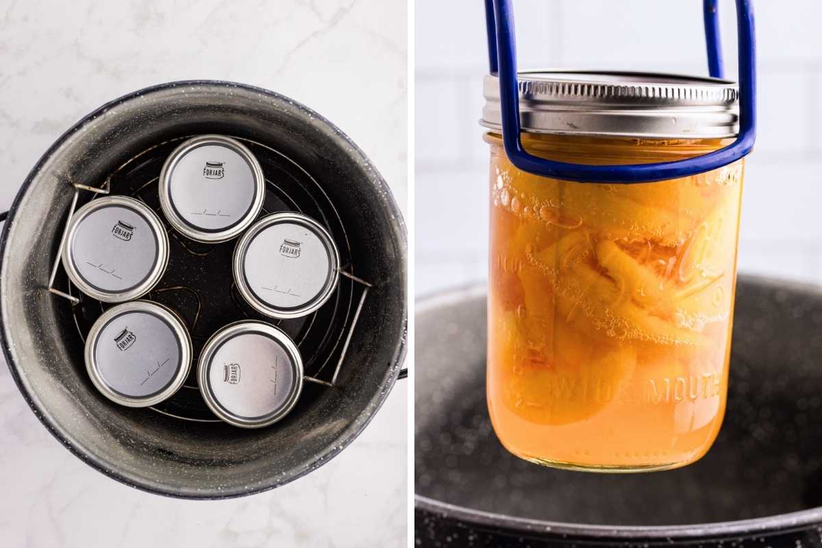 Five sealed jars arranged on a rack inside a black canning pot, with a jar lifter holding a jar of peaches above the canner.