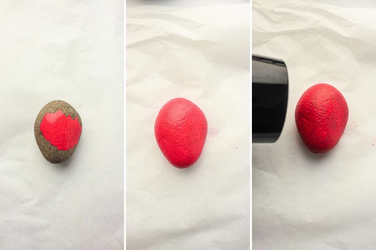 rock being painted oslid red and drying.
