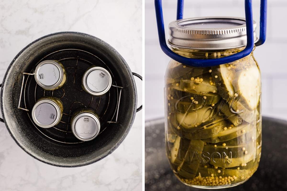 Jar lifter lowering a Ball Mason jar of sliced pickles into a black canning pot alongside four sealed jars on a rack.