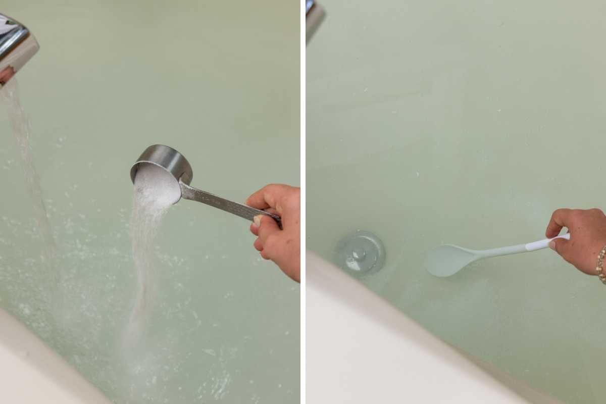 Powder being poured from a metal measuring cup into a bathtub then stirred with a white spoon.