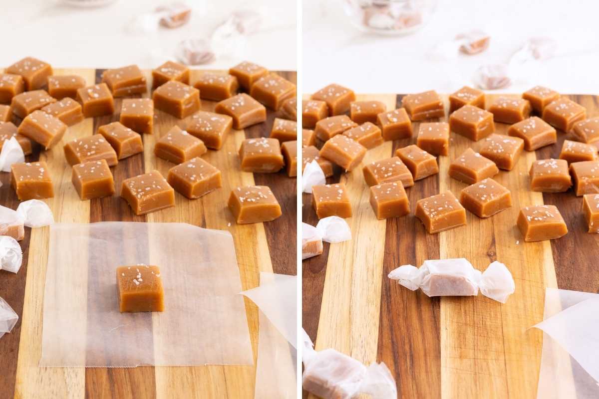 Salted caramel squares arranged on a wooden board, one being wrapped in wax paper.