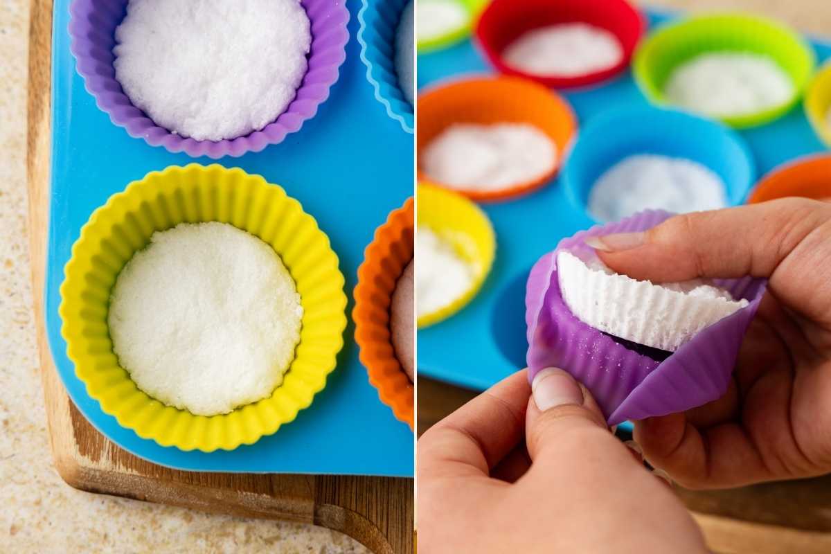 Hands peeling a purple silicone mold away from a hardened white washing machine tablet.