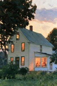 Farmhouse lit from within at dusk