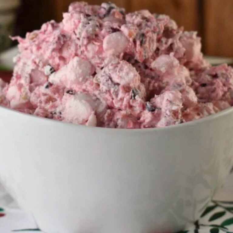 white bowl with cranberry fluff salad