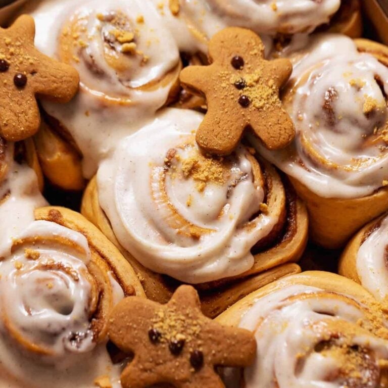 cinnamon rolls with gingerbread cookies as a garnish