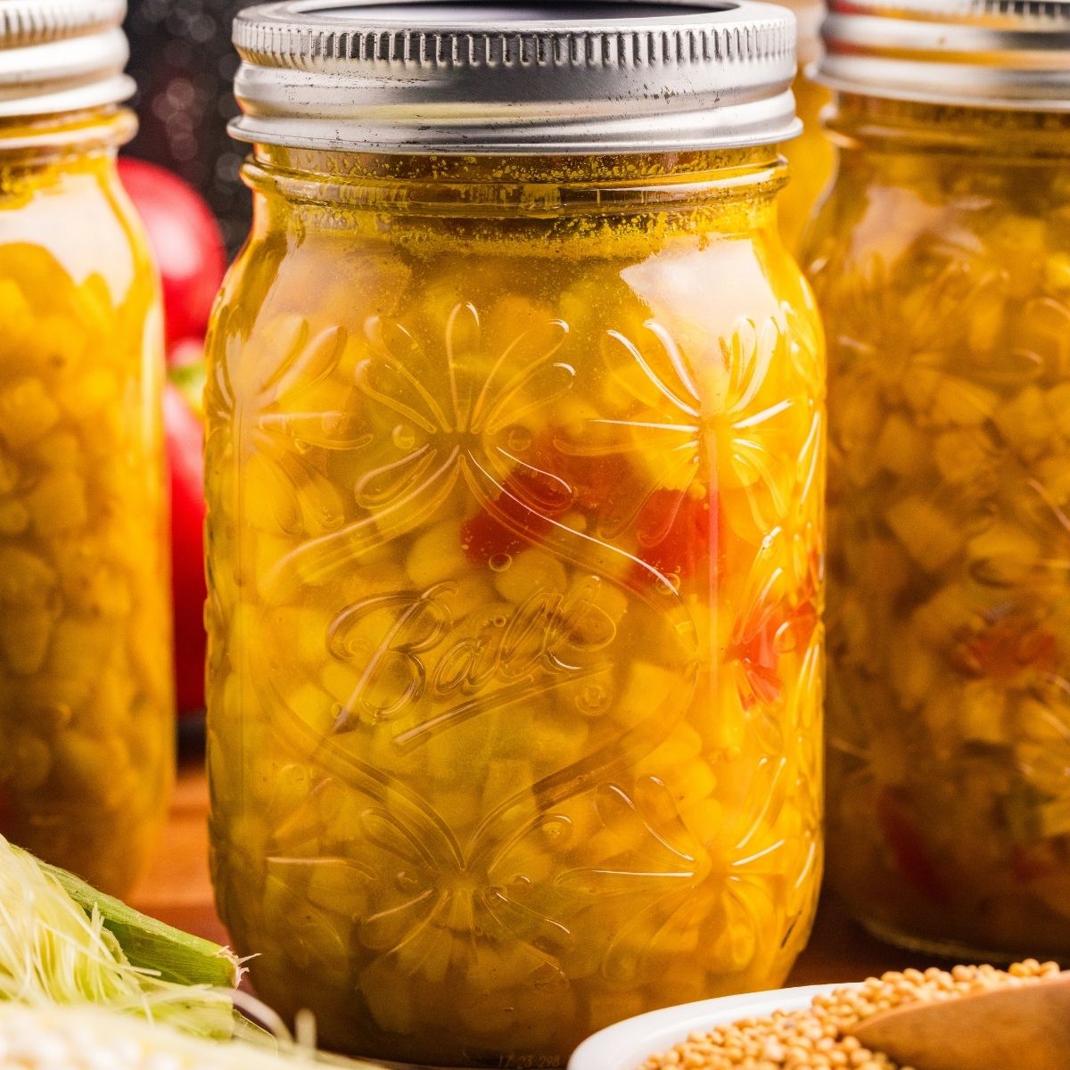 maosn jar of home canned corn relish.