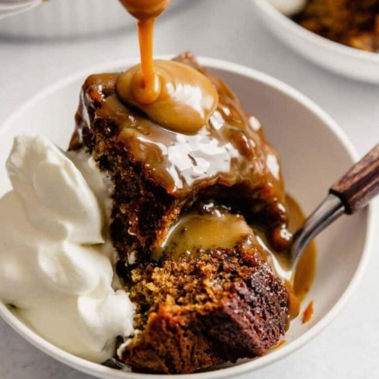 sticky toffee pudding with sauce being poured on top