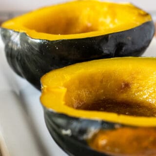 halves of acorn squash with melted butter and sugar 